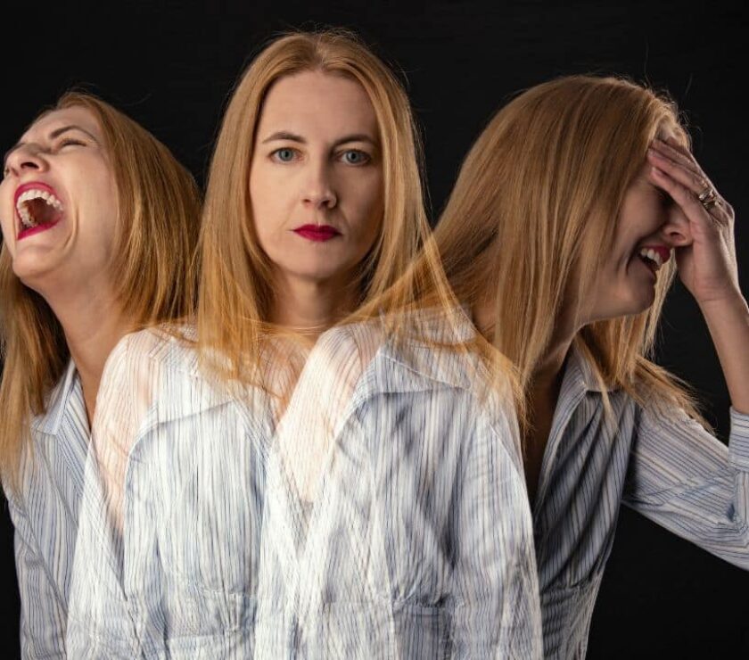 Mujer rubia con inestabilidad emocional, expresando alegría, seriedad y llanto al mismo tiempo representando un trastorno límite de la personalidad (TLP)